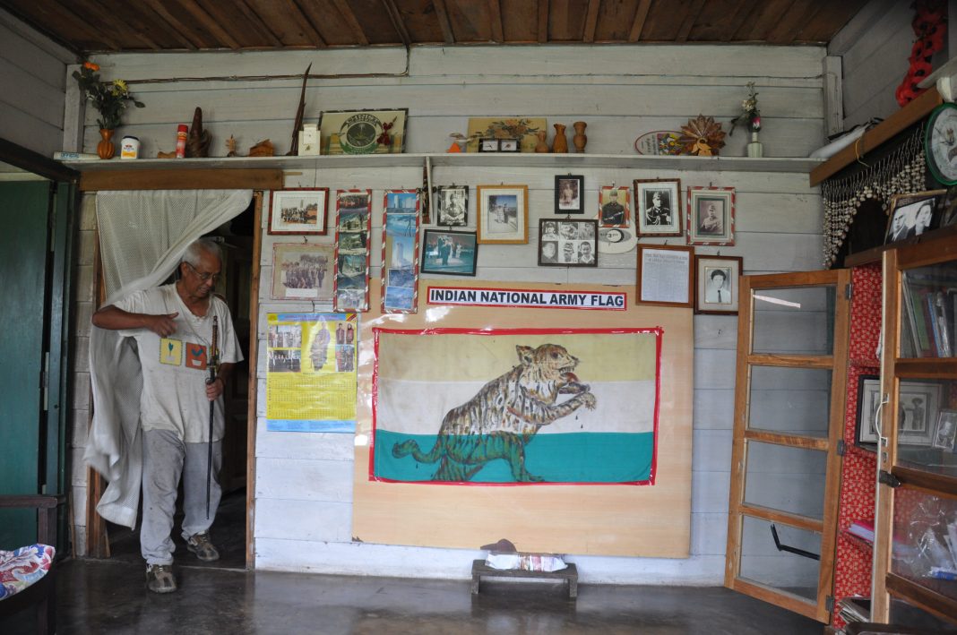 Shishak at his home in Manipur with the first flag of Indian Independence hoisted by Netaji Subhas Chandra Bose's Indian National Army. Photo courtesy: Anil Dhir